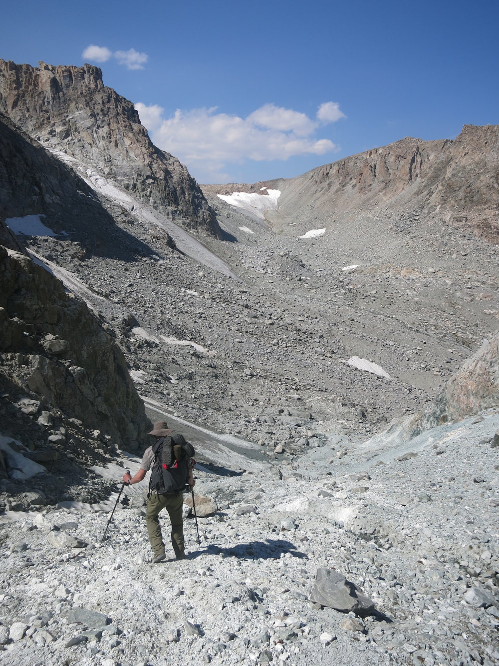 Beginning the steep descent from the gully.  Our next objective is that ice patch in the distance below the horizon.  