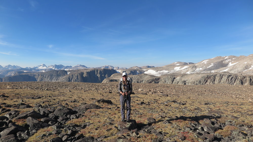 At the start of Goat Flats, with the Wind River Range behind me.  Gannett Peak is visible off to the left in the distance (we crossed that glacier below it!). 
