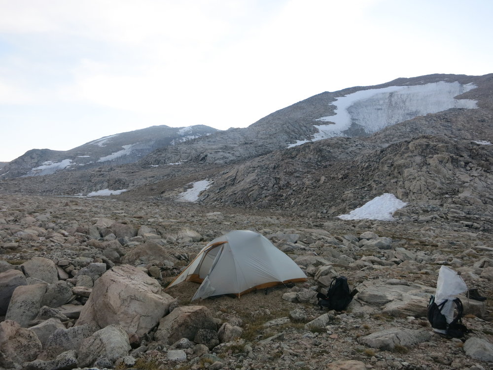 Our final campsite of the route.  The snow slope we descended earlier in the day is seen behind us.